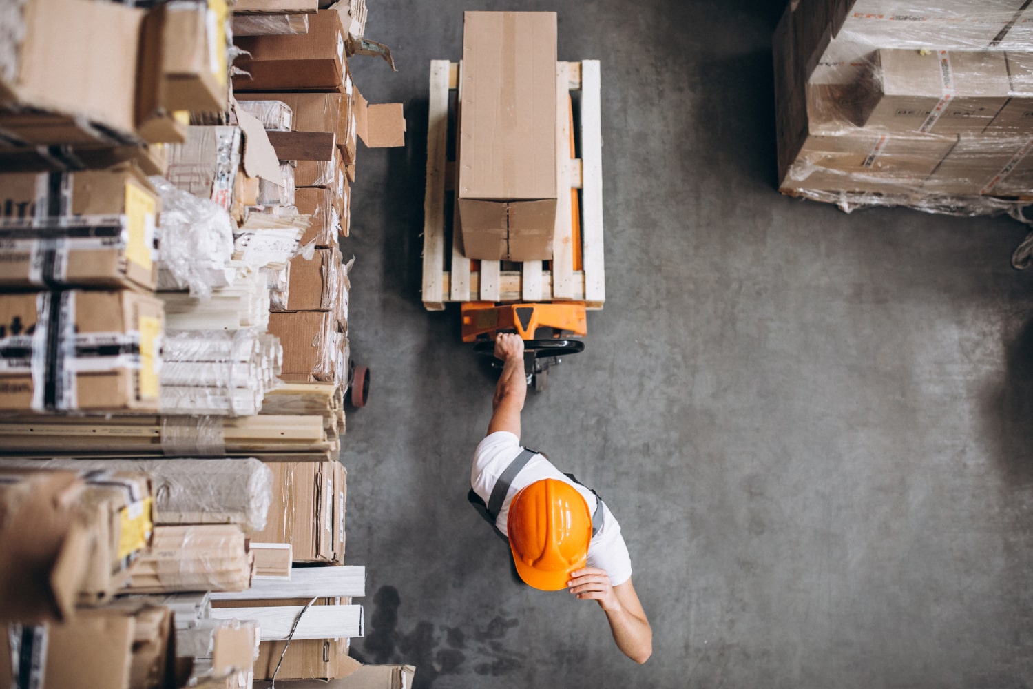 young-man-working-warehouse-with-boxes-min